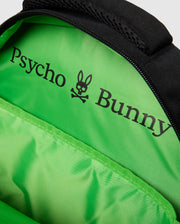 A close-up of the interior of the KIDS BACKPACK - B0A175D200 reveals a bright green lining. The brand name "Psycho Bunny" is printed in black on the vibrant fabric, with a distinctive bunny skull and crossbones logo situated between "Psycho" and "Bunny". The top seam is sleek in black, thoughtfully designed with an additional laptop pocket for convenience.