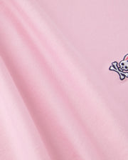 The Psycho Bunny KIDS CLASSIC CREW NECK TEE - B0U014CRPC is made of 100% Pima cotton, showcasing a pink fabric with an embroidered skull and crossbones. It offers a smooth texture and soft look, ideal for back-to-school outfits.