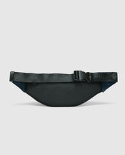 The Psycho Bunny MENS CROSS BODY BAG - B6A181E200, featuring a textured black surface, adjustable strap, and clasp buckle, is displayed against a white background, highlighting its minimalist and sleek design.