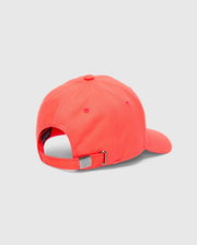 A MENS CLASSIC BASEBALL CAP - B6A816F200 by Psycho Bunny, in bright coral cotton twill, is displayed from the back. It has an adjustable fit with a metallic buckle and a top ventilation hole, set against a plain light gray background.