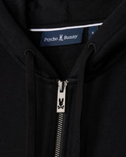 Close-up of the MENS LEVY ZIP FLEECE HOODIE - B6H720D200, focusing on a black cotton hoodie for men with a zipper featuring the iconic bunny logo and a "Psycho Bunny" label.