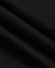 Here's a close-up shot of the MENS PACIFIC CHENILLE HOODIE - B6H930D200 by Psycho Bunny. The black fabric is folded into several layers, showcasing its smooth and soft texture with a subtle sheen. The image highlights the hoodie’s even weave and fine quality, reminiscent of premium French terry material.