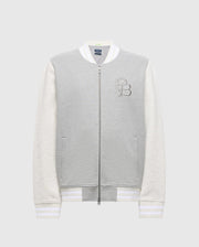 The MENS HYDRA COLOR BLOCK KNIT BOMBER - B6J455F200 by Psycho Bunny features a premium gray cotton-blend body and white sleeves, front zipper, "PB" logo on the left chest, and striped ribbed cuffs and hem for a classic look.