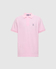 The Psycho Bunny Men's Classic Pique Polo Shirt (B6K001CRPC) is crafted from soft Peruvian pima cotton in light pink, with a collar, three buttons, and a small embroidered bunny logo on the left chest against a plain gray background.