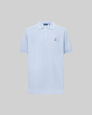 The Psycho Bunny MENS CLASSIC PIQUE POLO (B6K001F200) is a light blue short-sleeved Pima cotton men’s polo with a collar, two buttons, and an embroidered bunny logo on the left chest, shown on a plain gray background.