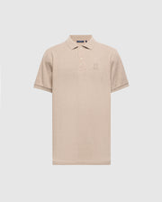 The MENS JAMES PREMIUM PIQUE POLO SHIRT - B6K945D200 by Psycho Bunny is a beige polo shirt, expertly crafted from durable Pima cotton. It features a subtle embroidered logo on the chest and is designed with short sleeves and a collar, offering a lightweight construction for a classic look set against a plain light gray background.