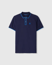 The Psycho Bunny MENS KENT PIQUE POLO SHIRT - B6K951D200 is a navy men's Pima cotton polo with light blue collar and sleeve trim, featuring a stylized bird logo on the left chest and a button-down placket, offering style and comfort.