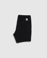 Black Psycho Bunny eco-friendly shorts with an elastic waistband and a label on the back, displayed on a plain white background.