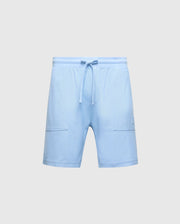 The Psycho Bunny MENS TAYLOR LIGHT PIQUE SWEATSHORT (B6R344F200) in light blue, featuring a drawstring waist and two front pockets, is showcased on a plain gray background, making it an essential casual-chic wardrobe addition.