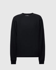 The Psycho Bunny MENS TAYLOR PIQUE LONG SLEEVE TEE (B6T580F200) features a black Pima cotton crew neck design with ribbed cuffs and a small embroidered emblem on the left chest, displayed on a plain light gray background.