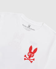 The MENS NEW YORK TEE - B6U554W1PC featuring a red bunny skull and crossbones logo with "NY" written on the bunny's head. Crafted from Pima cotton jersey, the shirt’s brand name, "Psycho Bunny," is printed on the inside neckline tag in black text, accompanied by a small bunny logo above it.