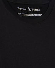 Here's a detailed description of the MENS JAMES PREMIUM CREW NECK TEE - B6U952D200 by Psycho Bunny: This close-up highlights the black, premium tee, showcasing "Psycho Bunny" printed at the inner neckline. Expertly crafted from 100% Pima cotton and made in Peru, it features a small bunny logo with crossbones neatly situated between "Psycho" and "Bunny." The text details are presented in multiple languages for an international appeal.