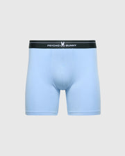 Light blue boxer briefs crafted from a soft Modal blend with a black waistband featuring the white "Psycho Bunny" text. A small stylized bunny logo adorns the center of the waistband on a plain gray background. Product: MENS 2 PACK BOXER BRIEF - B6V481F200 by Psycho Bunny.