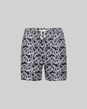Psycho Bunny KIDS CYRUS ALL OVER PRINT SWIM TRUNK - KB1000001: Black quick-dry seersucker swim trunks with a white snake print and red accents, elastic waistband, and white drawstring, shown on a gray background for effortless coastal style.