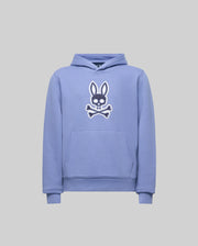 The Psycho Bunny KIDS RYDER EMBROIDERED BUNNY PATCH HOODIE (KT0500018) features a light purple color, front pocket, hood, and a large white and black embroidered bunny head above crossbones on the chest. Cozy style shown on gray background.