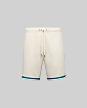 The MENS BASIL TAPED SHORT - MB0900005 by Psycho Bunny, in beige cotton-modal blend, features a drawstring waist and green-blue striped hem, styled on a plain gray background for a classic look.