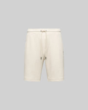 The Psycho Bunny MENS KAI TWILL TEXTURE SWEATSHORT (MB0900015) in beige features a twill-textured finish, elastic waistband with adjustable drawstring, side pockets, and an embroidered Bunny logo, shown against a gray background.
