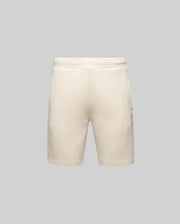 The Psycho Bunny MENS LAZSLO SWEATSHORT (MB0900016) in light beige features an elastic waistband, side pockets, and a stretch modal-cotton-blend for comfort—ideal for casual wear. Shown from the front on a plain gray background.