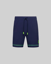 Psycho Bunny TENNIS BALL CREW MENS SHORT - MB0900017: Navy blue quick-dry shorts with drawstring waist, neon green tips, green hem stripes, and a small green clover logo on the left leg. Displayed on a plain gray background. Perfect for tennis or workouts.