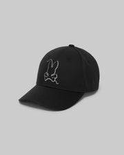 The Psycho Bunny MENS CYRUS BASEBALL CAP - MO1500045 is a black cap with an embroidered white bunny head above crossed bones on the front, styled for subtle coastal charm against a plain light gray background.
