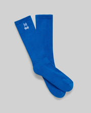 The Psycho Bunny MENS 3 PACK SPORT SOCK (MO2200006) features bright blue Pima cotton crew socks with a small white bunny logo near the top, shown on a plain gray background.