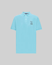 The Psycho Bunny MENS CYRUS PIQUE POLO - MT0100056 features light blue Pima cotton, short sleeves, a collar with two buttons, and an embroidered cartoon rabbit holding a bone on the left chest.