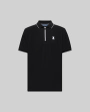 The Psycho Bunny MENS DANE ZIP PIQUE POLO (MT0100103) features black short sleeves, a white zip placket collar, white sleeve trim, and a small white graphic logo on the left chest, shown against a plain gray background.