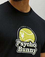 Close-up of a person wearing the MENS PETE GRAPHIC TEE - MT0200012 by Psycho Bunny, a soft Pima cotton black tee featuring a yellow tennis ball, white bunny silhouette, and "TENNNIS CLUB Psycho Bunny" on the front.