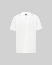 The Psycho Bunny MENS JAYME KNIT SEERSUCKER CABANA COLLAR SHIRT - MT0300002 is a white, short-sleeved, button-up shirt with a relaxed cabana collar, shown against a plain light gray background.