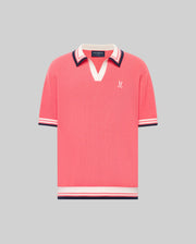 The Psycho Bunny MENS CARTER JOHNNY COLLAR KNIT POLO (MT0400093) is a coral pink, short-sleeved 100% cotton shirt featuring a V-neck Johnny collar, striped cuffs in white, navy, and red, and a small white logo on the left chest.