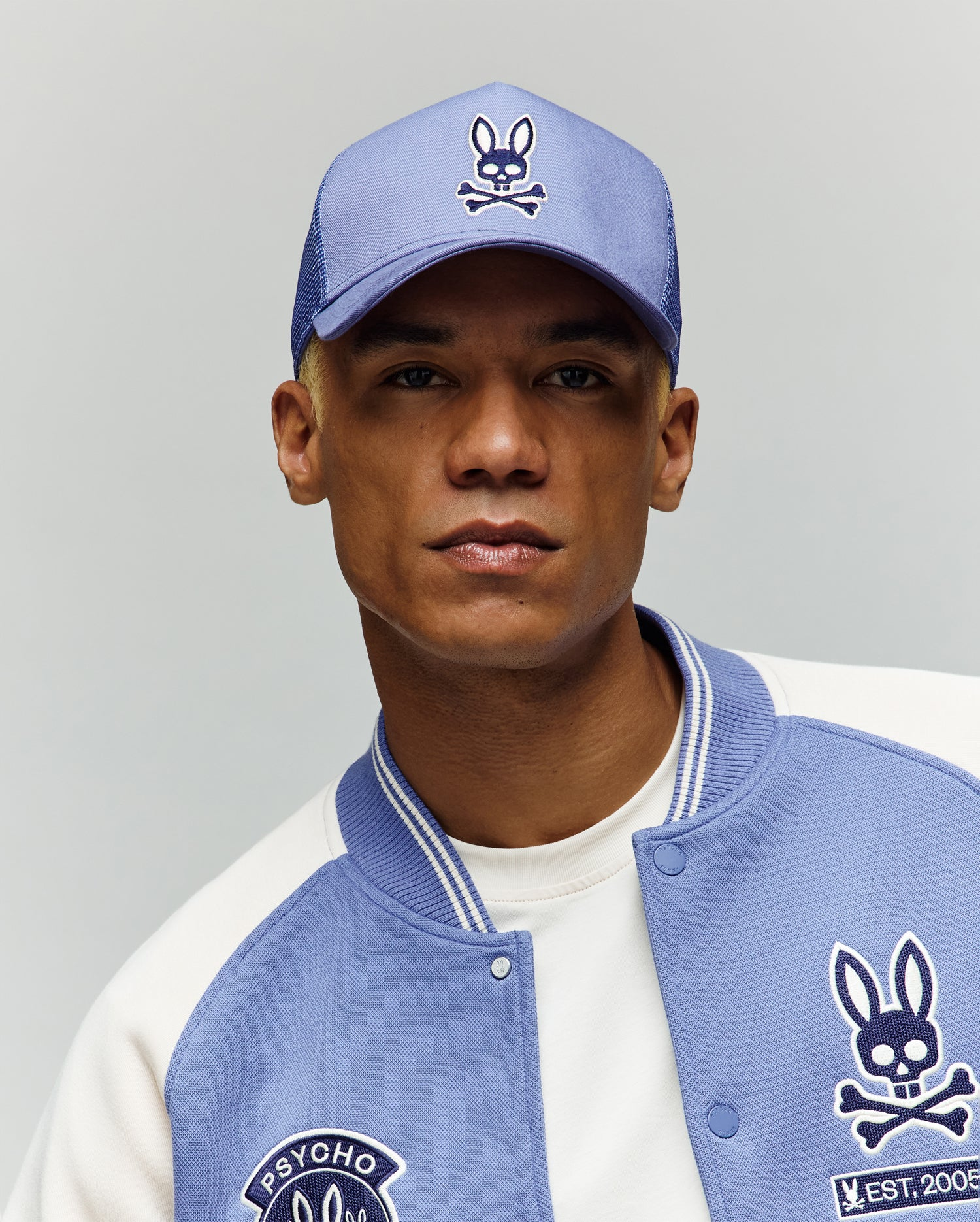 model wearing a beige cap