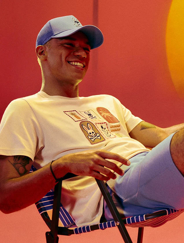 man wearing an orange sport tee