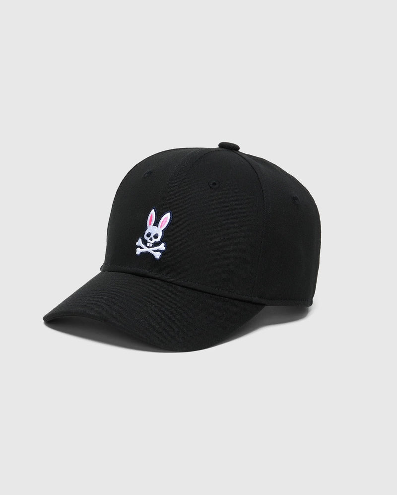 The KIDS CLASSIC BASEBALL CAP - B0A816A1HT by Psycho Bunny features a black color with an embroidered bunny and pink-eared skull and crossbones on the front. It offers an adjustable fit and is set against a plain gray background for a stylish look.