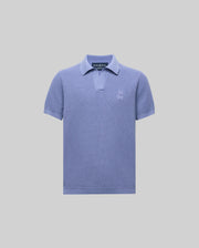 The Psycho Bunny KIDS LEETON JOHNNY COLLAR KNIT POLO (B0E562F200) is a light purple cotton sweater polo with a Johnny collar, short placket, and embroidered logo on the chest, shown against a plain light gray background.