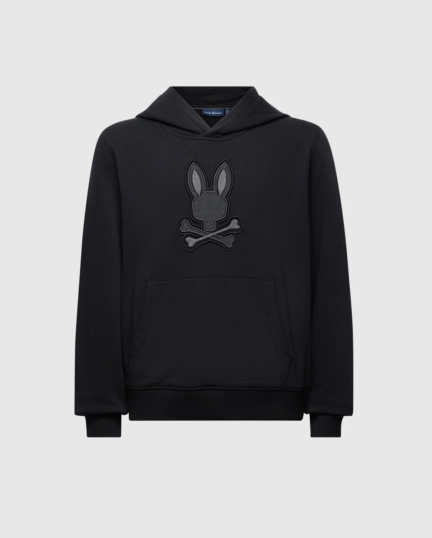 Introducing the Psycho Bunny Kids New Castle Embroidered French Terry Hoodie (B0H517F200), a luxurious black piece with a large front pocket and an embroidered bunny above crossed bones, featuring long sleeves and a comfy hood, set against a light gray background.