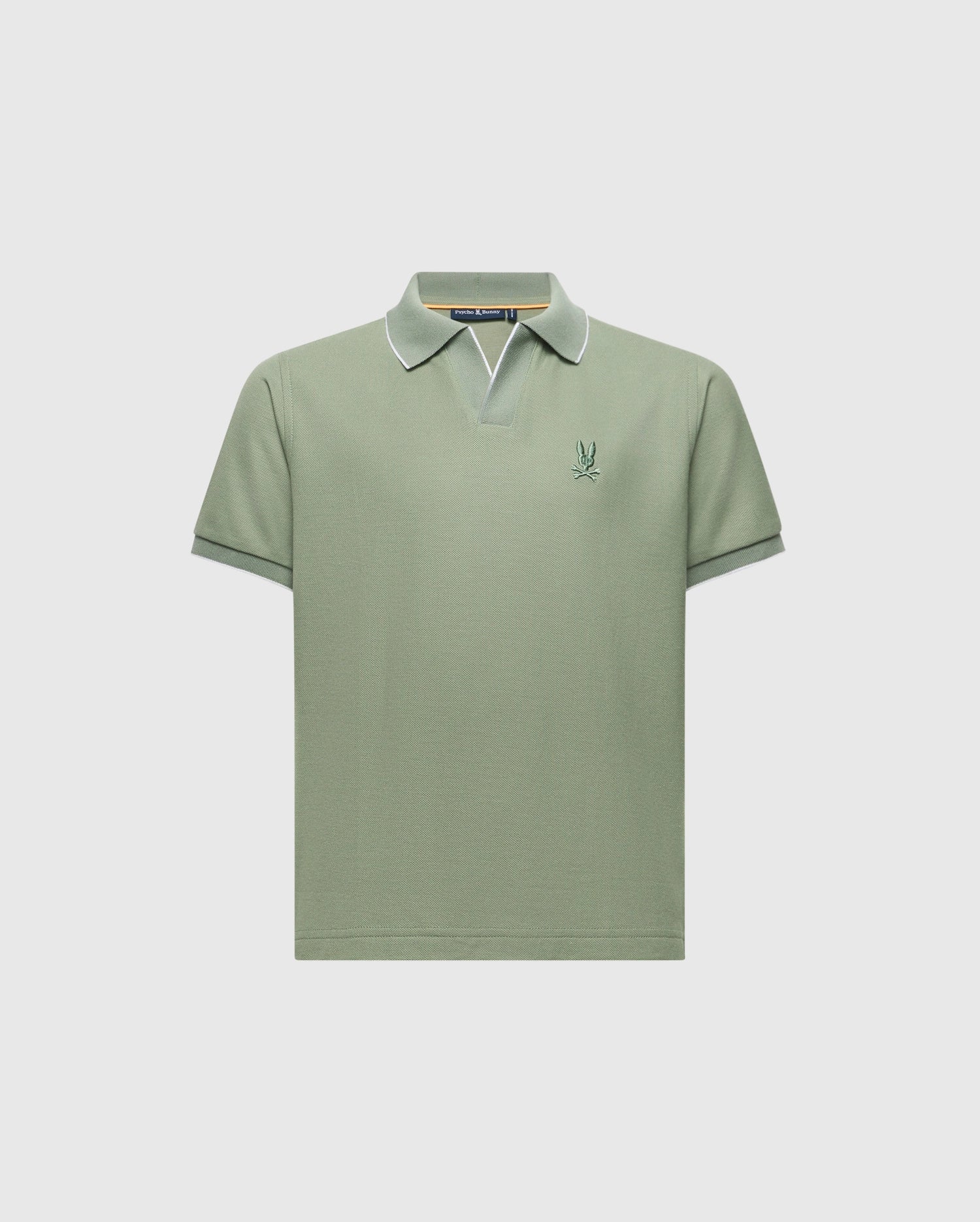 The KIDS EAST HILLS JOHNNY COLLAR POLO - B0K331B200 by Psycho Bunny is a light green, 100% Pima cotton short-sleeve shirt with a Johnny collar featuring white edging and a small embroidered logo on the left chest, exuding a seaside vibe against a plain white background.
