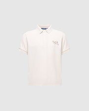The Psycho Bunny KIDS DESERT PIQUE POLO - B0K506F200 is a classic, gray Pima cotton shirt with a collar, short sleeves, and features an embroidered crown and "Polo Factory" on the left chest for a timeless look.