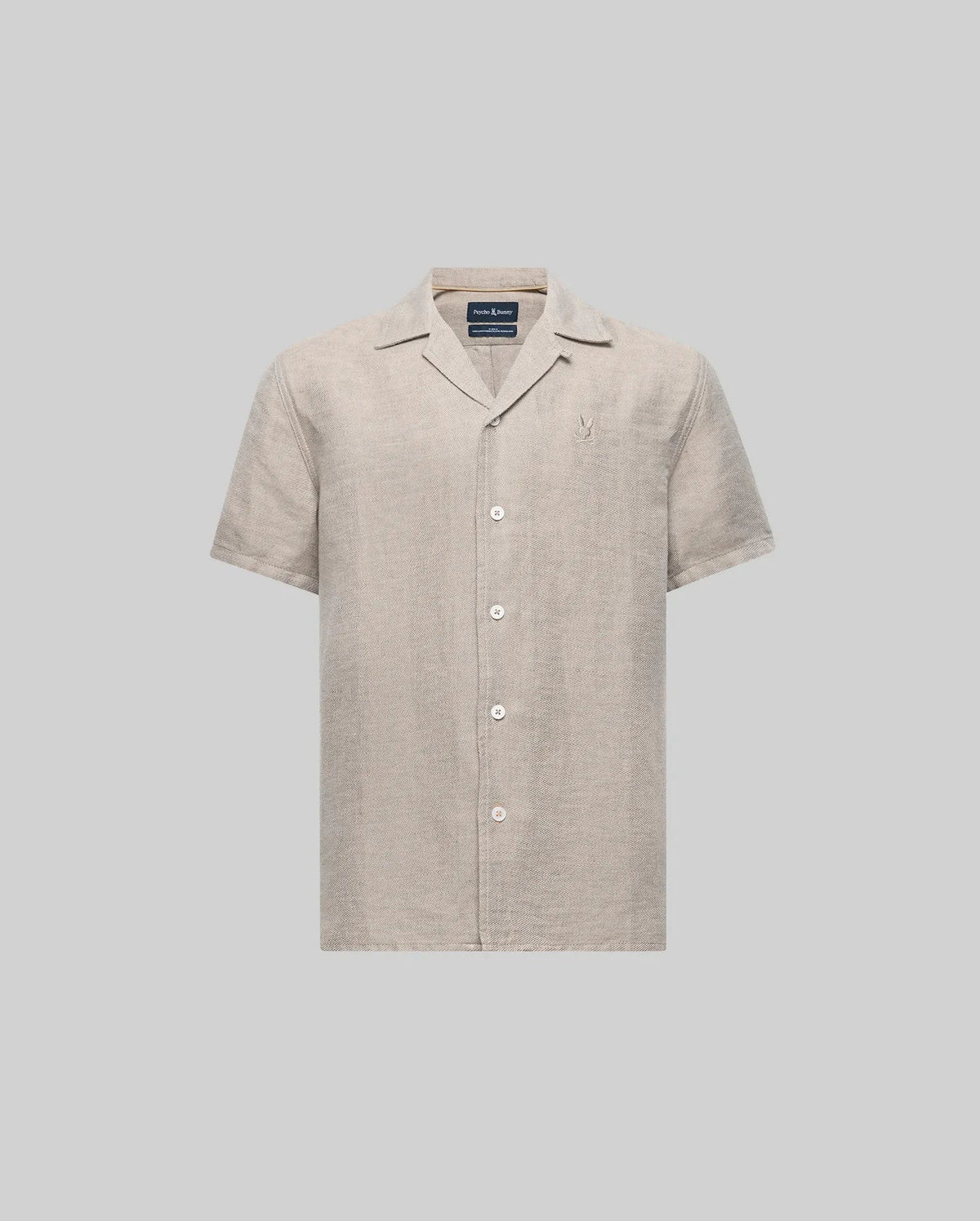 The Psycho Bunny KIDS WINDCREST LINEN BLEND SHORT SLEEVE SHIRT (B0Q148C200) is a light beige button-up with an open spread collar, mother-of-pearl buttons, chest logo embroidery, and is made from a soft linen-cotton blend.