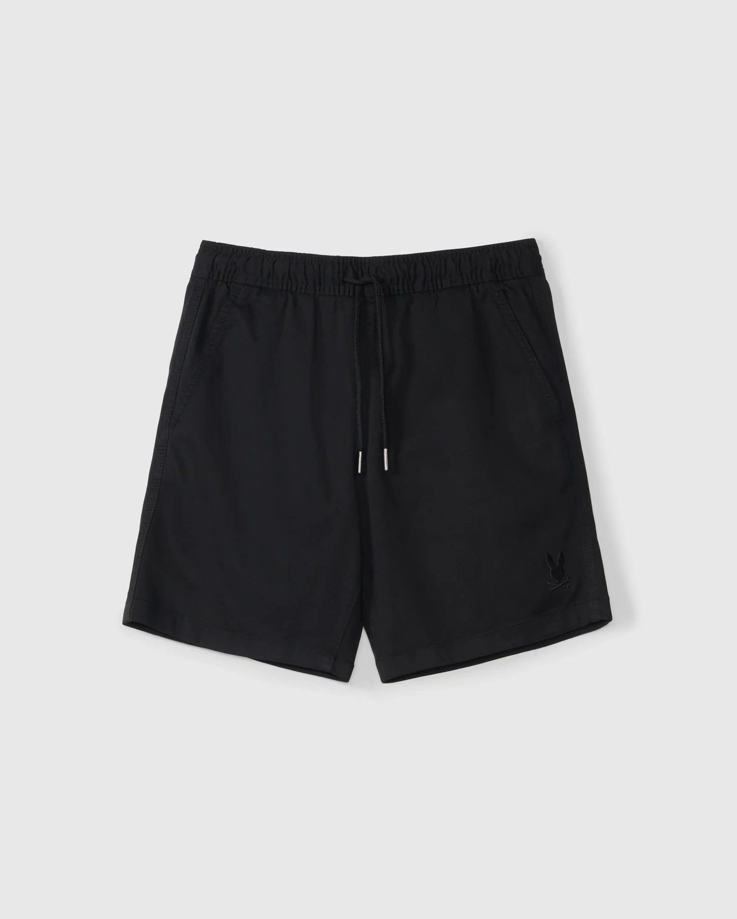 The KIDS WILLIS STRETCH TENCEL SHORT - B0R239Y1WB by Psycho Bunny are black athletic shorts with a slim fit, elastic waistband, and drawstring. They feature side pockets and an embroidered bunny logo on the lower left front and are laid flat on a light gray background.