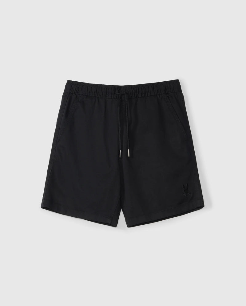 The KIDS WILLIS STRETCH TENCEL SHORT - B0R239Y1WB by Psycho Bunny are black athletic shorts with a slim fit, elastic waistband, and drawstring. They feature side pockets and an embroidered bunny logo on the lower left front and are laid flat on a light gray background.