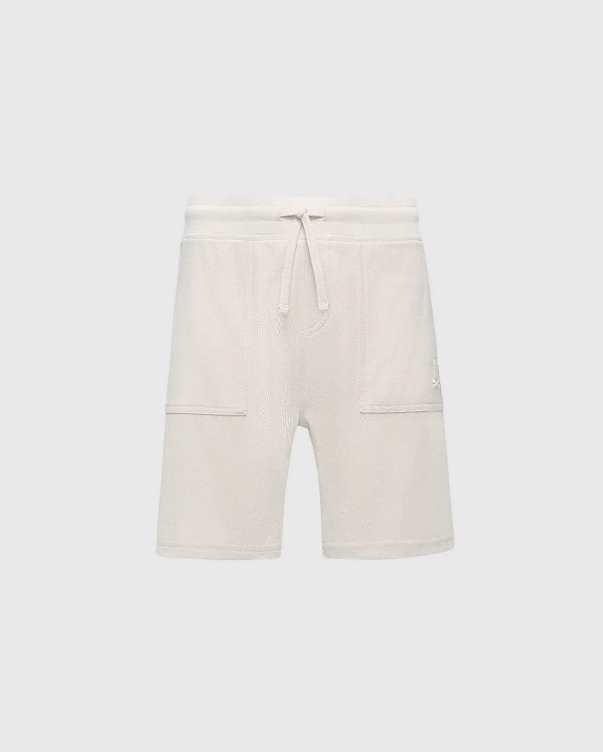 The Psycho Bunny KIDS TAYLOR LIGHT PIQUE SWEATSHORT (B0R344F200) features a cream-colored, Pima cotton design with a drawstring waist and two large front pockets, offering soft comfort and adding casual-chic style to any wardrobe. Perfect for an effortlessly stylish everyday look.