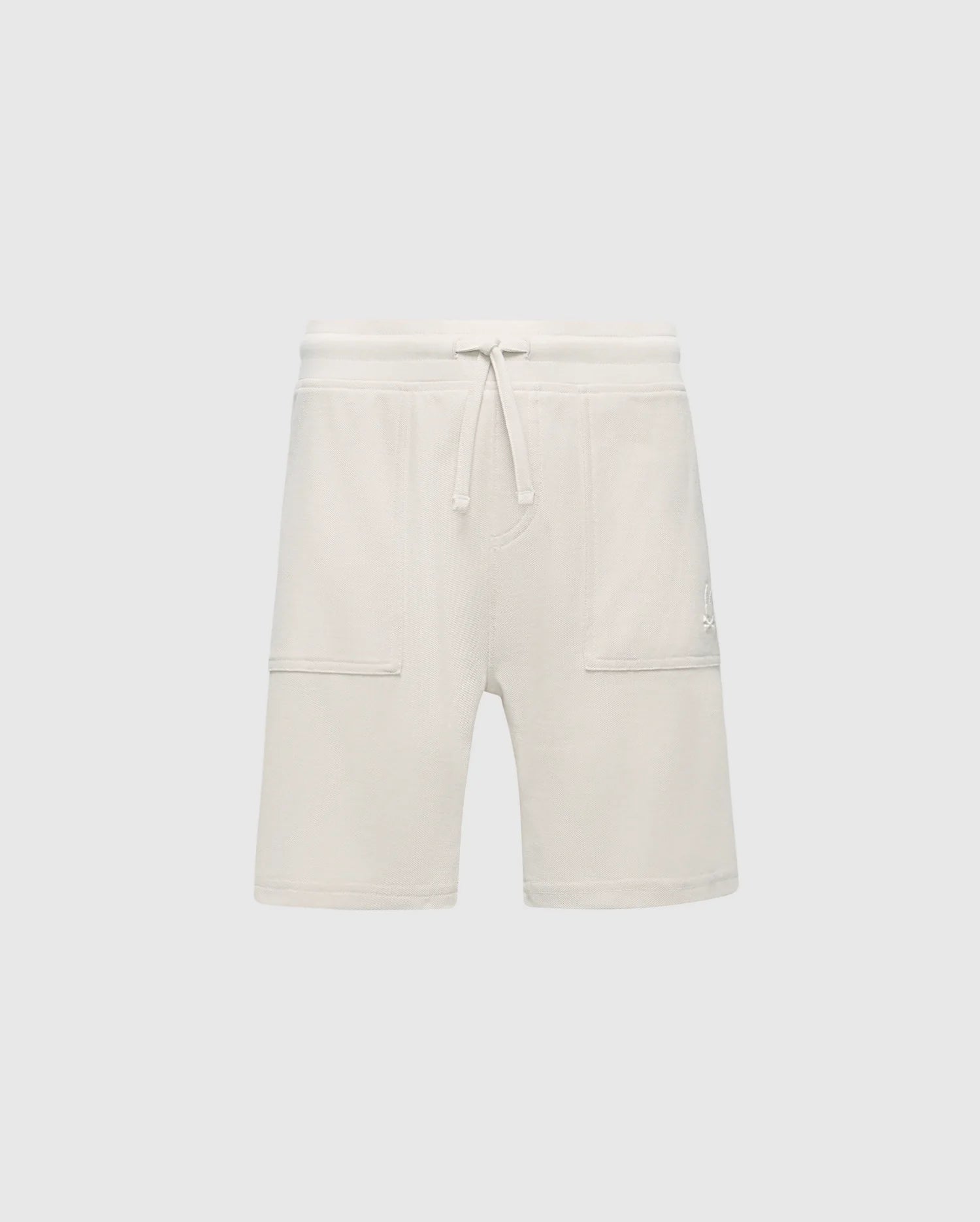 The Psycho Bunny KIDS TAYLOR LIGHT PIQUE SWEATSHORT (B0R344F200) features a cream-colored, Pima cotton design with a drawstring waist and two large front pockets, offering soft comfort and adding casual-chic style to any wardrobe. Perfect for an effortlessly stylish everyday look.