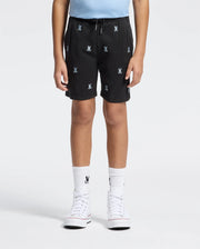 A child wears Psycho Bunny KIDS ALL OVER WILLIS STRETCH TENCEL SHORTS (B0R559F200) featuring white bunny logos, a light blue shirt, matching bunny socks, and white high-top sneakers, standing against a plain white background.