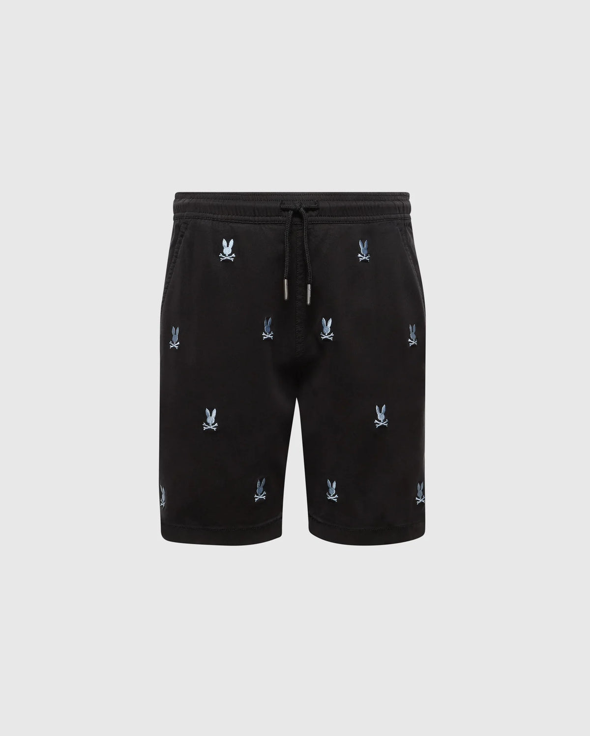 The KIDS ALL OVER WILLIS STRETCH TENCEL SHORT by Psycho Bunny features black drawstring shorts with an elastic waist and an all-over light blue Bunny logo pattern, shown on a plain light gray background.