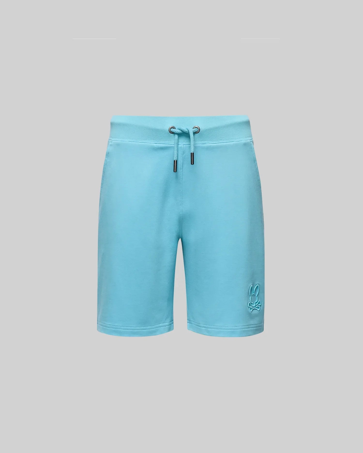 Psycho Bunny KIDS LEVANZO EMBROIDERED MICRO FRENCH TERRY SWEATSHORT - B0R578F200 in light blue offers ultimate comfort, with two metal grommets at the waistband and an embroidered bunny logo near the bottom left hem, shown on a gray background.