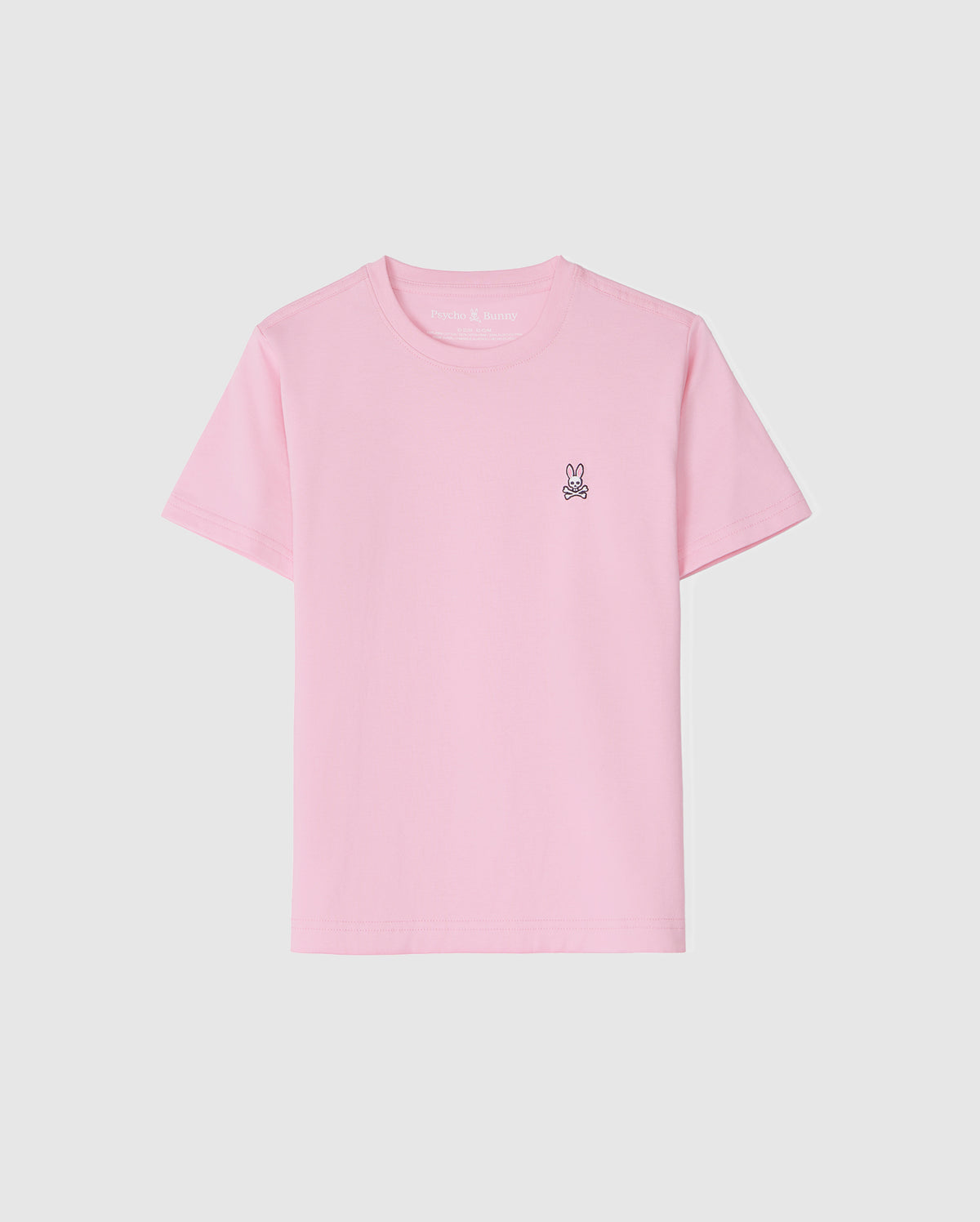 The KIDS CLASSIC CREW NECK TEE - B0U014CRPC by Psycho Bunny is a light pink kids' tee made of 100% Pima cotton. It features a small embroidered bunny logo on the upper left against a white background, offering comfort and style for back-to-school outfits.