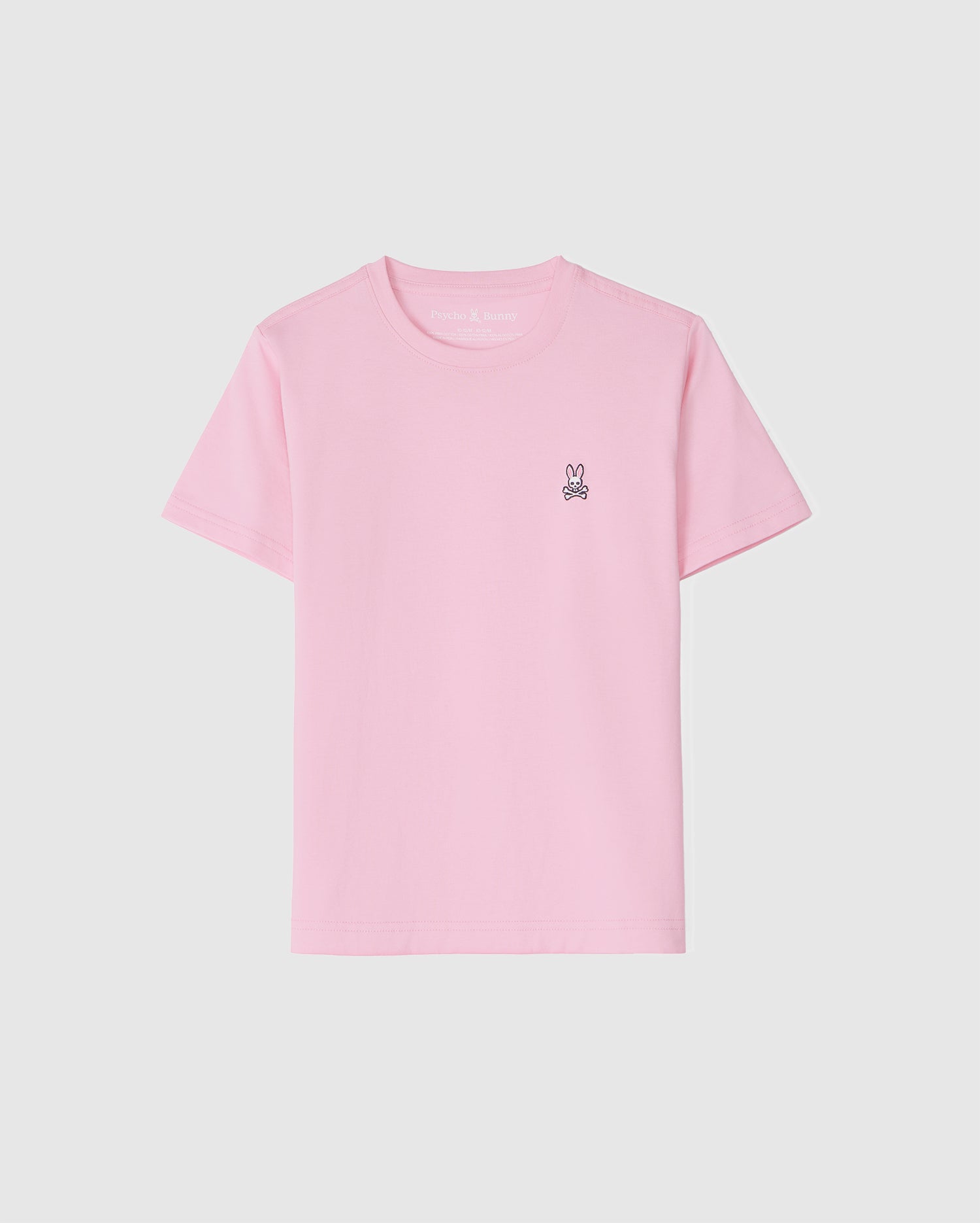 The KIDS CLASSIC CREW NECK TEE - B0U014CRPC by Psycho Bunny is a light pink kids' tee made of 100% Pima cotton. It features a small embroidered bunny logo on the upper left against a white background, offering comfort and style for back-to-school outfits.