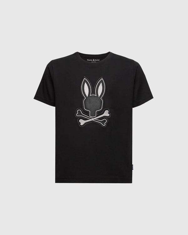 The Psycho Bunny KIDS NEW CASTLE EMBROIDERED GRAPHIC TEE (B0U415F200) is a black tee made from soft Pima cotton, featuring a centered gray and white embroidered bunny head with crossbones.