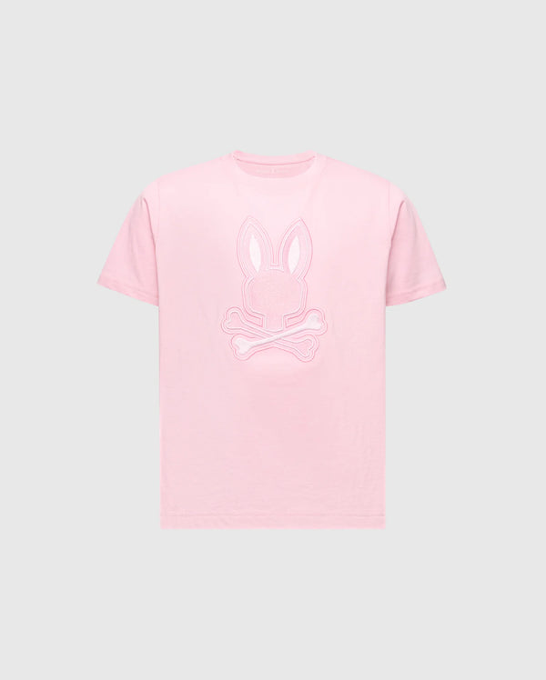 The KIDS NEW CASTLE EMBROIDERED GRAPHIC TEE - B0U415F200 by Psycho Bunny features a pink tee with a bunny head and skull and crossbones embroidery on the chest, all in premium Pima cotton set against a gray background.