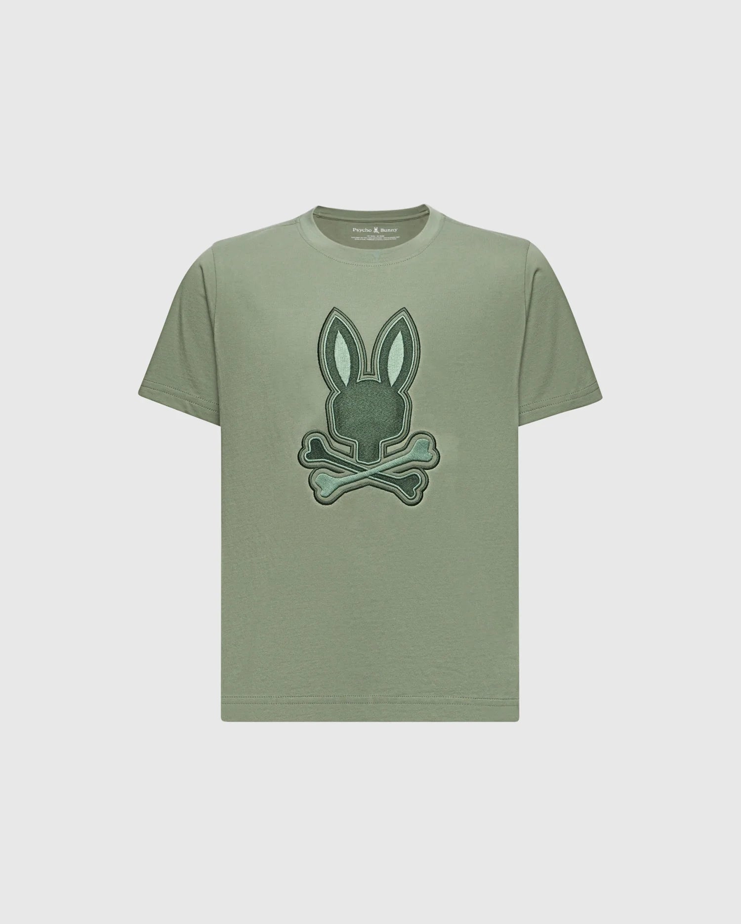 The KIDS NEW CASTLE EMBROIDERED GRAPHIC TEE by Psycho Bunny (B0U415F200) features a stylized embroidered bunny head above crossed bones, centrally positioned on the chest against a plain background. Made from Pima cotton.